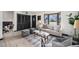 Inviting living room with bay window, hardwood floors, neutral colors, and modern decor at 6298 S Harlan Way, Littleton, CO 80123