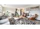 Comfortable living room with hardwood floors, neutral colors, and abundant light at 6298 S Harlan Way, Littleton, CO 80123
