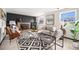 Cozy living room with wood burning fireplace, hardwood floors, and comfortable seating at 6298 S Harlan Way, Littleton, CO 80123