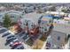 Aerial view of this condo and complex show casing stairs, units, trees, and parking at 970 S Dawson Way # 15, Aurora, CO 80012