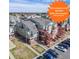 Inviting condo complex featuring ample parking, exterior stairways, and a well-maintained green space at 970 S Dawson Way # 15, Aurora, CO 80012