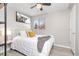 Cozy bedroom with a comfortable bed, ceiling fan, and natural light at 970 S Dawson Way # 15, Aurora, CO 80012