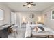 Comfortable bedroom featuring carpet floors and modern design with a desk and art at 970 S Dawson Way # 15, Aurora, CO 80012