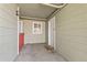 View of a private entrance with outdoor storage, a window, and neutral-colored siding at 970 S Dawson Way # 15, Aurora, CO 80012