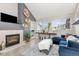 Inviting living room featuring a fireplace, large windows, and stylish decor, creating a warm and welcoming ambiance at 970 S Dawson Way # 15, Aurora, CO 80012