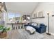 Living room showcasing vaulted ceilings, neutral walls, light wood floors and view to the outside at 970 S Dawson Way # 15, Aurora, CO 80012
