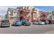 Exterior view of the townhome complex, featuring assigned parking area at 970 S Dawson Way # 15, Aurora, CO 80012