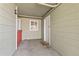 A cozy outdoor patio with a white door and window, ideal for creating a private and relaxing space at 970 S Dawson Way # 15, Aurora, CO 80012