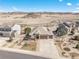 An aerial view of a home with a spacious yard, professional landscaping, and mountain views at 5238 Clearbrooke Ct, Castle Rock, CO 80104