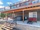 Backyard patio with outdoor seating, hot tub, and a convenient staircase at 5238 Clearbrooke Ct, Castle Rock, CO 80104