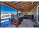 Relaxing covered patio with cozy seating, hot tub, and beautiful views at 5238 Clearbrooke Ct, Castle Rock, CO 80104