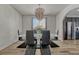 Bright dining room featuring modern light fixture, window views and glass top dining table at 5238 Clearbrooke Ct, Castle Rock, CO 80104