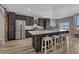 Kitchen with stainless appliances, tile backsplash, pendant lights, and an island with seating at 5238 Clearbrooke Ct, Castle Rock, CO 80104