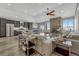 Open living space with stone fireplace, modern furniture, and an adjacent kitchen with granite counters at 5238 Clearbrooke Ct, Castle Rock, CO 80104