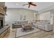 Spacious living room featuring vaulted ceilings, wood floors, a ceiling fan and a stone fireplace at 5238 Clearbrooke Ct, Castle Rock, CO 80104