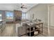 Open living room showcasing vaulted ceilings, wood floors, a stone fireplace and mountain views at 5238 Clearbrooke Ct, Castle Rock, CO 80104