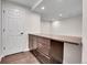 Basement featuring a bar area with cabinets, countertop and tile floor at 10115 Foxridge Ct, Highlands Ranch, CO 80126