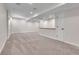 Spacious finished basement with neutral carpet, and a counter with cabinets at 10115 Foxridge Ct, Highlands Ranch, CO 80126
