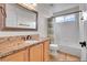 Bathroom with granite vanity, shower-tub combination, and tile flooring at 10115 Foxridge Ct, Highlands Ranch, CO 80126
