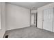 Bedroom with gray carpet, white walls and a closet with a door at 10115 Foxridge Ct, Highlands Ranch, CO 80126
