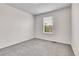 Bright bedroom featuring neutral carpet, walls, and window with blinds at 10115 Foxridge Ct, Highlands Ranch, CO 80126
