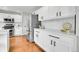 Kitchen with white cabinets, stainless steel appliances, and modern design at 10115 Foxridge Ct, Highlands Ranch, CO 80126