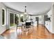 Bright kitchen features a modern design, stainless steel appliances and a kitchen island with bar stool seating at 10115 Foxridge Ct, Highlands Ranch, CO 80126
