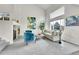 Bright living room featuring large windows, plush seating, fireplace and modern decor at 10115 Foxridge Ct, Highlands Ranch, CO 80126