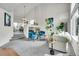 Open-concept living area with fireplace, featuring comfortable seating and views of the dining area at 10115 Foxridge Ct, Highlands Ranch, CO 80126