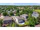 Backyard aerial view showcases a lovely two-story home with a patio and grassy yard at 20455 E Grand Ln, Aurora, CO 80015
