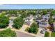 Neighborhood aerial showcasing mature landscaping and multiple homes with solar panels at 20455 E Grand Ln, Aurora, CO 80015
