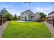 Landscaped backyard with well-maintained lawn and concrete patio at 20455 E Grand Ln, Aurora, CO 80015