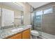 Modern bathroom with granite vanity, a glass enclosed shower and updated design at 20455 E Grand Ln, Aurora, CO 80015