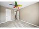 Neutral bedroom with an open doorway, two closets, natural light, and plush gray carpet at 20455 E Grand Ln, Aurora, CO 80015