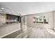 Modern kitchen with granite countertops, stainless steel appliances, and a breakfast bar at 20455 E Grand Ln, Aurora, CO 80015