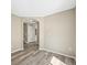 Neutral living room with gray floors and entryway to other parts of the house at 20455 E Grand Ln, Aurora, CO 80015