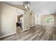 Spacious living room with new floors that flows into the kitchen; bright and airy at 20455 E Grand Ln, Aurora, CO 80015