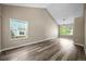 Bright living room with vaulted ceiling, hardwood floors, and large windows at 20455 E Grand Ln, Aurora, CO 80015