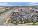Aerial view showcasing a modern townhome community with rooftop patios and convenient parking at 9072 E 47Th Ave, Denver, CO 80238