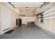 Spacious garage features a clean epoxy floor, ample shelving, and plenty of room for storage at 9072 E 47Th Ave, Denver, CO 80238