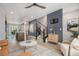 Spacious living room showcasing an open floor plan, sleek staircase, and modern decor with lots of light at 9072 E 47Th Ave, Denver, CO 80238