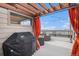 Relax on the rooftop patio, complete with a grill, pergola, and string lights for evening enjoyment at 9072 E 47Th Ave, Denver, CO 80238
