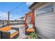 Enjoy this rooftop patio with stylish furniture and vibrant orange cushions, perfect for outdoor relaxation at 9072 E 47Th Ave, Denver, CO 80238