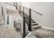 Modern staircase with sleek railings and carpeted steps, connecting the different levels of the home at 9072 E 47Th Ave, Denver, CO 80238