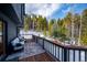 Spacious outdoor deck area complete with plush seating, offering scenic views and fresh air at 10756 Timothys Dr, Conifer, CO 80433