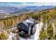 Striking two-story home boasts expansive decks with mountain views at 10756 Timothys Dr, Conifer, CO 80433