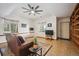 Cozy living room featuring a large couch, carpet, and recessed lighting beneath a ceiling fan at 10756 Timothys Dr, Conifer, CO 80433