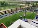 Scenic backyard with lush lawn, well-manicured landscaping, and a charming patio area at 8651 S De Gaulle Ct, Aurora, CO 80016