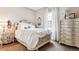 Bright bedroom featuring classic furniture, natural light, and a comfortable ambiance at 8651 S De Gaulle Ct, Aurora, CO 80016