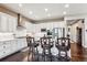 Well-lit kitchen featuring a large island with bar stool seating and stainless steel appliances at 8651 S De Gaulle Ct, Aurora, CO 80016